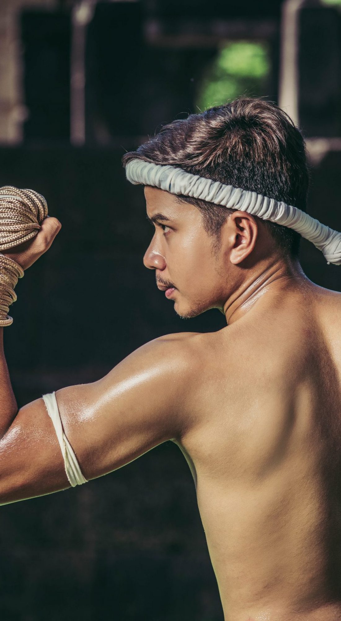 A boxer tied a rope in his hand and performed a fight, The martial arts of Muay Thai.